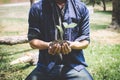 World environment day reforesting, Hands of young man were planting the seedlings and tree growing into soil while working in the