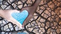 Environment Day.People hold hands in heart shape, with water and dry soil on the background. Water conservation concept Royalty Free Stock Photo