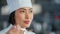World Famous Restaurant: Portrait of Smiling Asian Female Chef Cooking Delicious, Steamy, Authentic Royalty Free Stock Photo
