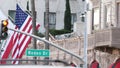 World famous Rodeo Drive Street Road Sign in Beverly Hills against American Unated States flag. Los Angeles, California, USA. Rich Royalty Free Stock Photo