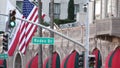 World famous Rodeo Drive Street Road Sign in Beverly Hills against American Unated States flag. Los Angeles, California, USA. Rich Royalty Free Stock Photo