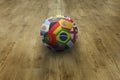 World flags soccer ball on parquet floor Royalty Free Stock Photo