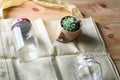 World free of plastic.Green products-bag made from bamboo or reuse, succulent and glass jar on nature wood background.