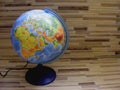 World Geographical Globe On The Wooden Table