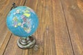 World Geographical Globe On The Wooden Table