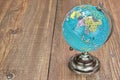 World Geographical Globe On The Wooden Table