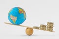 World globe and coins stack on balance scale - Concept of economic growth priority over planetary health Royalty Free Stock Photo