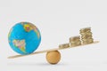 World globe and coins stack on balance scale - Concept of planetary health priority over economic growth