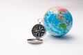 World globe and compass isolated over white background Royalty Free Stock Photo