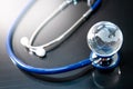 World globe crystal glass on stethoscope