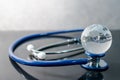 World globe crystal glass on stethoscope