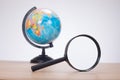 World globe with magnifying glass Royalty Free Stock Photo