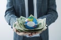 World globe with mask and dollar bills Royalty Free Stock Photo