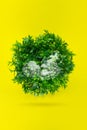 World globe shape of green grass with gologram fetus on yellow background. Life on earth - environment and ecology concept Royalty Free Stock Photo