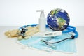 World globe, stethoscope, medical masks, sanitizer, thermometer on white background. Quarantine Concept of coronavirus, covid