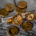 World Gold Coins Sit on Silver Bars Royalty Free Stock Photo