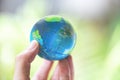 The world in the hand with nature background / hand holding globe environment green planet save the earth day Royalty Free Stock Photo