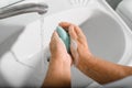 World hand washing day concept. Close-up of elderly woman washing her hands with soap in bathroom Royalty Free Stock Photo