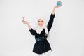 A world of harmony, save earth, time concept. Pretty Muslim girl in white hijab holding earth globe in one hand, and an Royalty Free Stock Photo