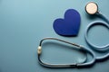 World health day. Blue heart and stethoscope on light blue background. Space for text Royalty Free Stock Photo