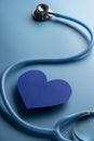 World health day. Blue heart and stethoscope on light blue background. Space for text Royalty Free Stock Photo