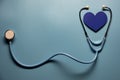 World health day. Blue heart and stethoscope on light blue background. Space for text Royalty Free Stock Photo