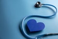 World health day. Blue heart and stethoscope on light blue background. Space for text Royalty Free Stock Photo