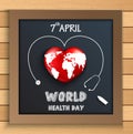 World health day concept with globe inside heart on blackboard on wooden table