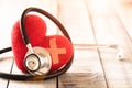 World health day, Healthcare and medical concept. Red heart with Stethoscope on wooden table background texture Royalty Free Stock Photo