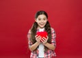 World health day. Little girl holding big red heart. Little child expressing love on valentines day. Cute girl in love
