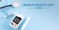 World health day and medical concept.Top view of diabetes tester set with stethoscope on bright blue pastel background Royalty Free Stock Photo
