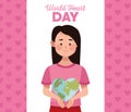 World heart day lettering with woman lifting heartshaped earth