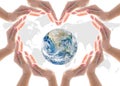 World heart health day concept with collaborative hands protection in heart shape: Elements of this image furnished by NASA