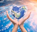 World in heart shape with over women human hands Royalty Free Stock Photo