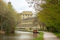 Canal boat approaches Saltaire