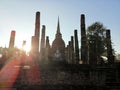 A World Herritage Buddha in Thailand with a sun set and silhouette