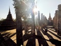 A World Herritage Buddha in Thailand with a sun set and silhouette