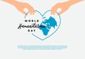 World humanitarian day background with hand hold blue world map in love heart symbol and handwritten text isolated on white grey Royalty Free Stock Photo