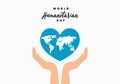 World humanitarian day background with handwritten text, world map in blue love heart symbol and opened han isolated on white Royalty Free Stock Photo