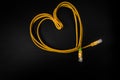 World Information Day - yellow wire like heart on the black background