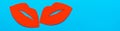 World Kiss Day. A pair of red cardboard lips on a blue background. Web banner