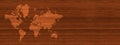 World map on brown wooden wall background. Horizontal banner