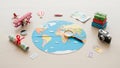 World map depicting continents surrounded by travel themed objects Royalty Free Stock Photo
