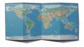 World map drawn on a folded sheet, planisphere leaning on a surface. Physical map