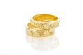 World Map Golden Wedding Rings Isolated On White Background