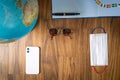 World map and items on wooden background, flat lay. summer travel wanderlust concept, space for text. map camera sunglasses Royalty Free Stock Photo