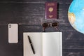 World map and items on wooden background, flat lay. Royalty Free Stock Photo