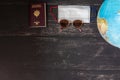 World map and items on wooden background, flat lay. Royalty Free Stock Photo