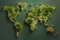 World map made from green grass and leaves. Ecology and green environment concept isolated on dark green background. Created with Royalty Free Stock Photo