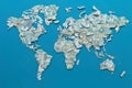 The world map is made up of pieces of different banknotes.